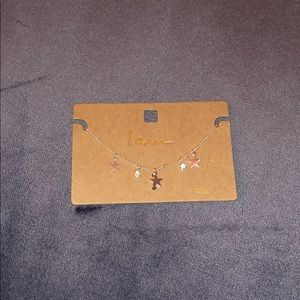 A gold ankle bracelet